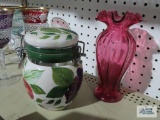 Fruit motif canister and cranberry colored vase