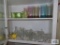 Lot of colored plastic ware...and clear glassware