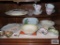 Lot of decorative plates, bowls, mugs,...etc in bottom of cabinet