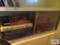Lot of assorted books on bottom shelf