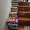 Four stacks of assorted books
