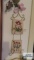 Plate hanger with floral wall hangings
