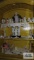Lot of figurines, miniature clock, decorative items, vases and etc on top shelves of cabinet