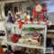 Christmas decorations, Christmas mugs, wreaths and etc on shelf and around shelf