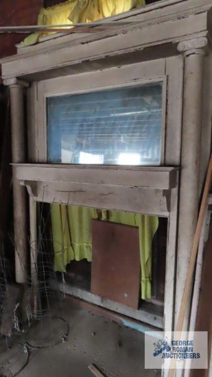 Antique fireplace mantel with mirror