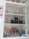 Lot of glasses and etc in cabinet