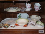 Lot of decorative plates, bowls, mugs,...etc in bottom of cabinet