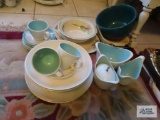 Green mixing bowl, baking dish with stand, assorted plates, etc