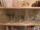 Lot of clear glassware including salt and pepper shakers, glasses, decanters, pitcher