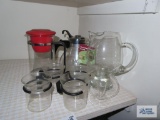 Lot of glass kettles, pitcher and glass mugs