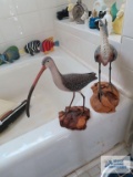 Two wooden bird figurines