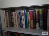 Lot of books on top two shelves