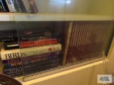 Lot of assorted books on bottom shelf