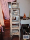 Three aluminum step ladders