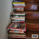 Three stacks of cookbooks