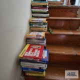 Four stacks of assorted books