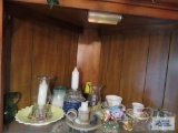 Lot of assorted glassware and figurines on top shelf