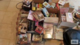 Lot of DVDs, VHS tapes, 8-track tapes, and Samsung Blu-ray 3D player. No remote.