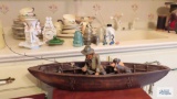 Wooden boat with figurine and dog figurine