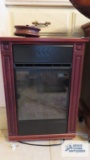 Mahogany finish roll about electric heater