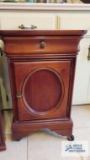 Cherry finish roll about end table