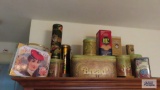 Lot of assorted tins on top of cabinet