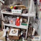 Lot of Plumbing hardware, paints, extension cords and etc on shelving