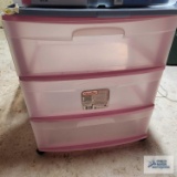 Plastic roll about three drawer cabinet