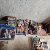 Seven boxes/totes of VHS tapes