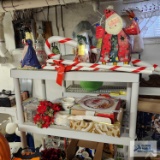 Christmas decorations, Christmas mugs, wreaths and etc on shelf and around shelf