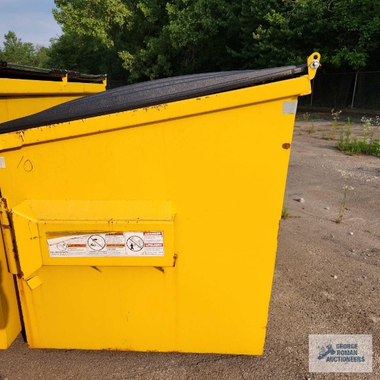 4 YARD FRONT LOAD METAL DUMPSTER WITH PLASTIC LIDS.