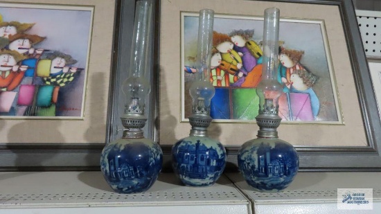 Lot of three blue village scene oil lamps