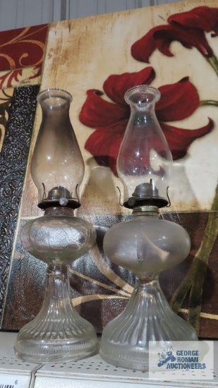 Lot of two clear glass oil lamps