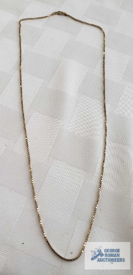 Gold colored box chain marked 14KT