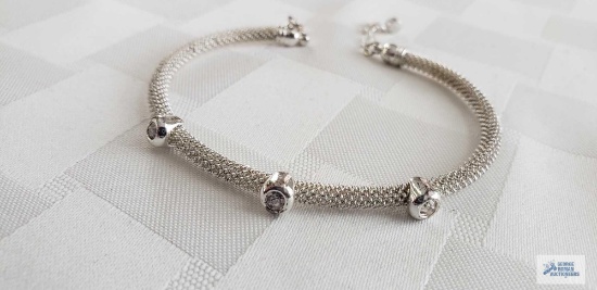 Silver colored mesh bracelet with clear stones 10.0 G, marked Avon