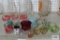 Assorted glassware including juice glasses and hand-painted vases