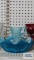 Blue glass pitcher, bowl, and Walt Disney World frilled advertising plates