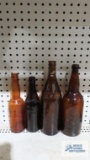 Lot of four brown bottles