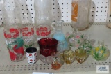 Assorted glassware including juice glasses and hand-painted vases