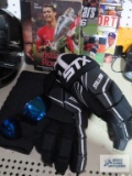 Athletic books, sunglasses, gloves and knee brace