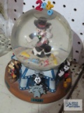 Mickey Millennium snow globe playing as time goes by. One figurine is broken
