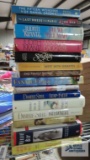 Various books including Danielle Steel, Sandra Brown, Judith Krantz