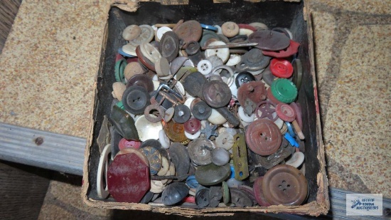 Box of vintage buttons, buckles, and others