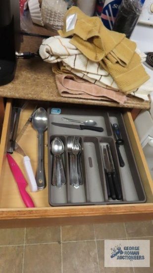 Lot of flatware, steak knives, towels and etc