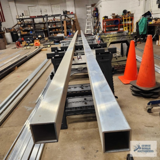 Two heavy aluminum stock pieces, 24 ft long