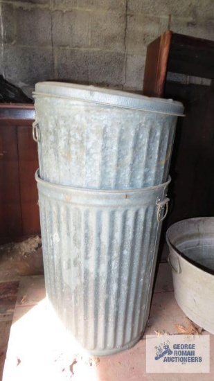 Lot of two metal trash cans with one lid