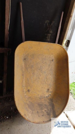 Wheelbarrow with pneumatic wheel. Wheel will need put back on the rim