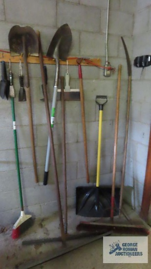Lot of brooms, shovels, squeegees, etc