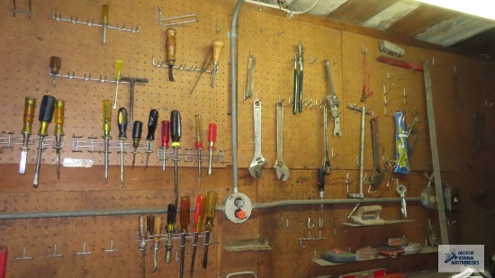 Lot of tools and etc on pegboard