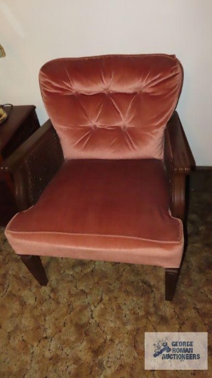 Pink armchair with wooden frame